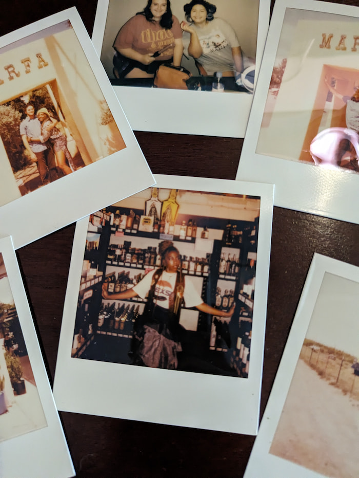 An assortment of polaroids on a table